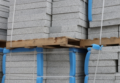 Block insulation stacked in a warehouse.