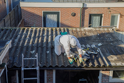 Picture of man working on asbestos cement sheets