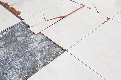 Picture of broken asbestos floor tiles
