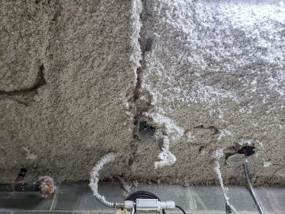Spray-on insulation on a ceiling.