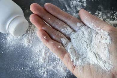 Talcum powder on hands.