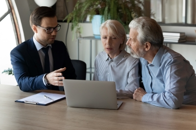 older couple consult with a mesothelioma attorney about which asbestos trust funds to file a claim with.